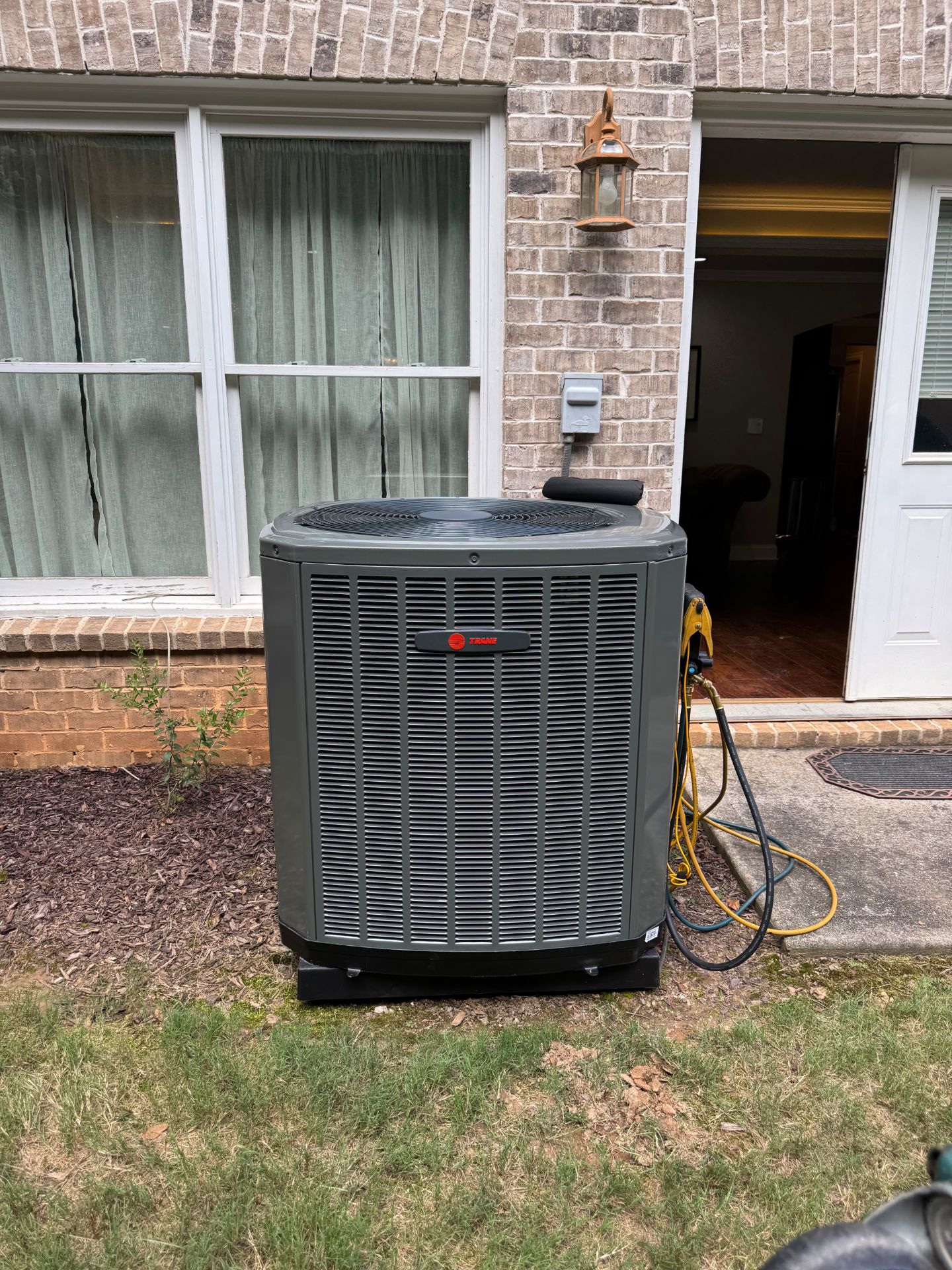 Residential air conditioning unit serviced by Conserve